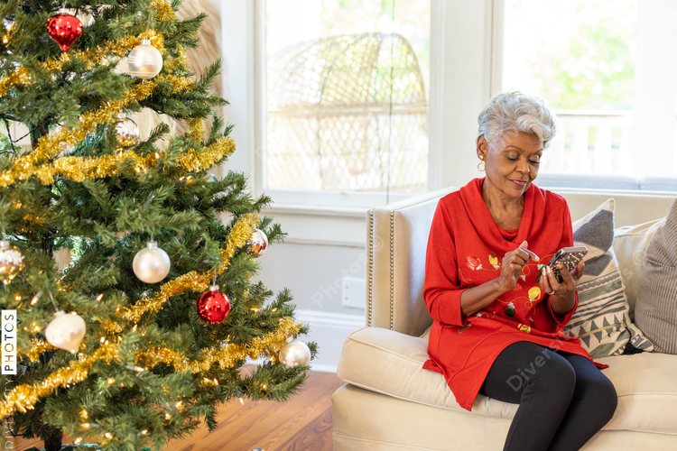 Grandmother on smartphone reading holiday text messages