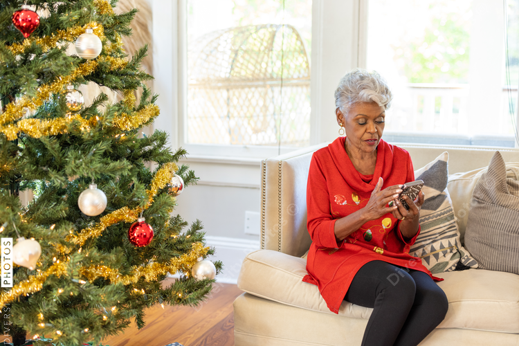 Grandmother on smartphone reading holiday text messages