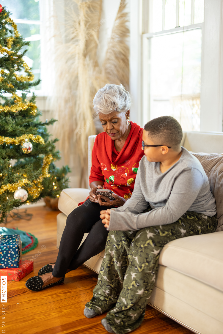 Grandmother and grandson talking in family room