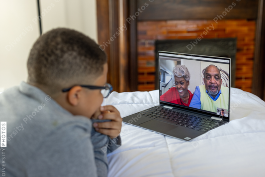 Young boy having video chat with grandparents on Christmas