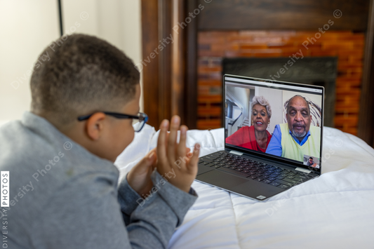 Young boy having video chat with grandparents on Christmas