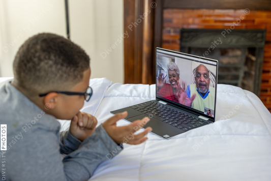 Young boy having video chat with grandparents on Christmas