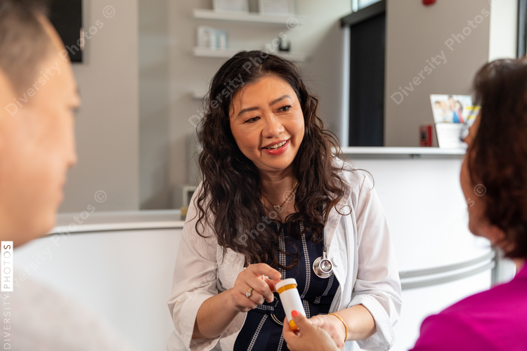 Doctor explaining prescription to patient in medical office