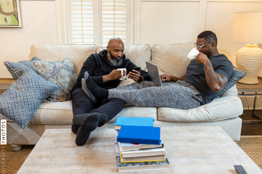 Black gay couple at home in living room, loving relationship