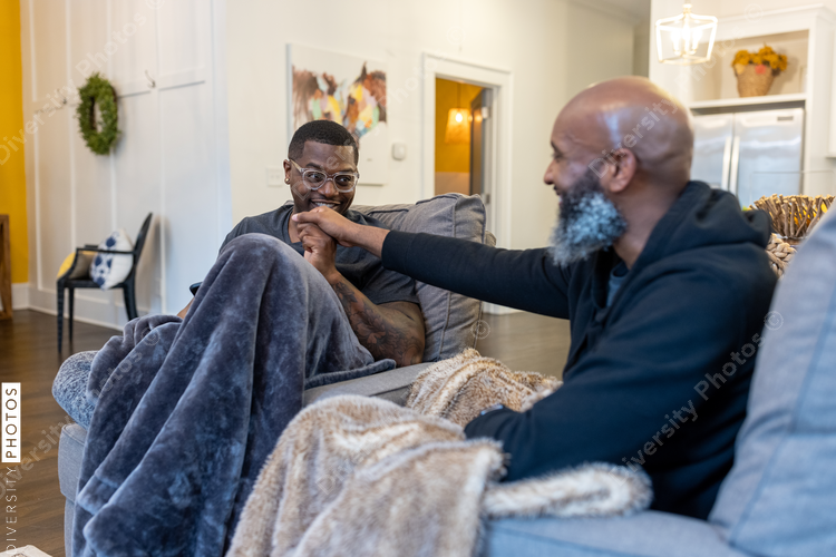 Lovely Black gay couple cozy at home, love connections