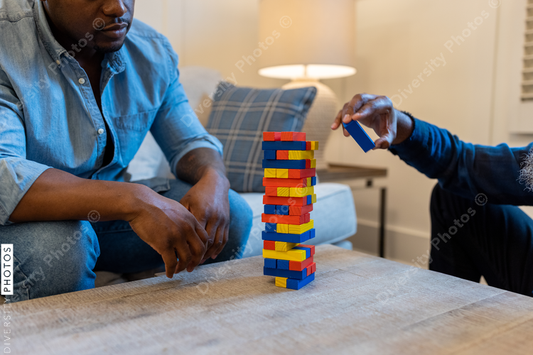 African American gay couple has game night at home