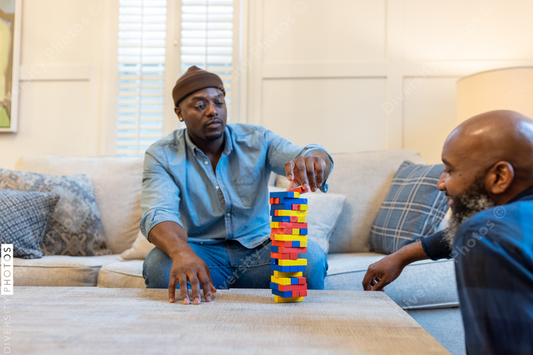 African American gay couple has game night at home