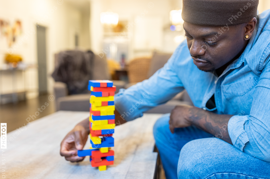 African American gay couple has game night at home