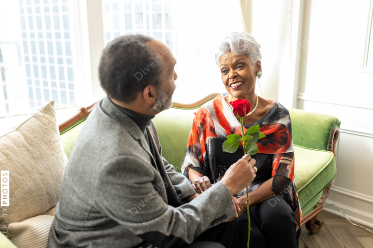 Senior Black couple at home, celebrating love, happiness  and anniversary, formal wear